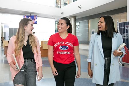 Students walking in Student Support Services building